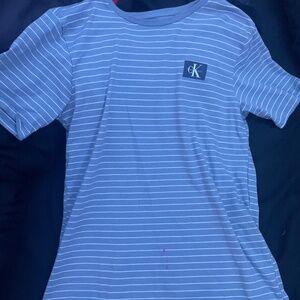 Im Selling my Calvin Klein Designer Shirt, Jeans, and a sports athletic shirt.